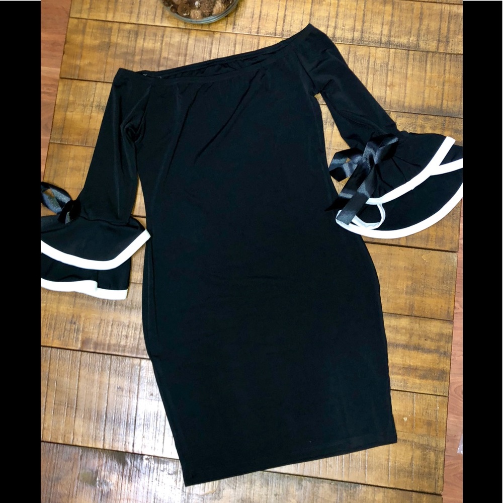 Black stretch, bell sleeved with ribbon dress.
